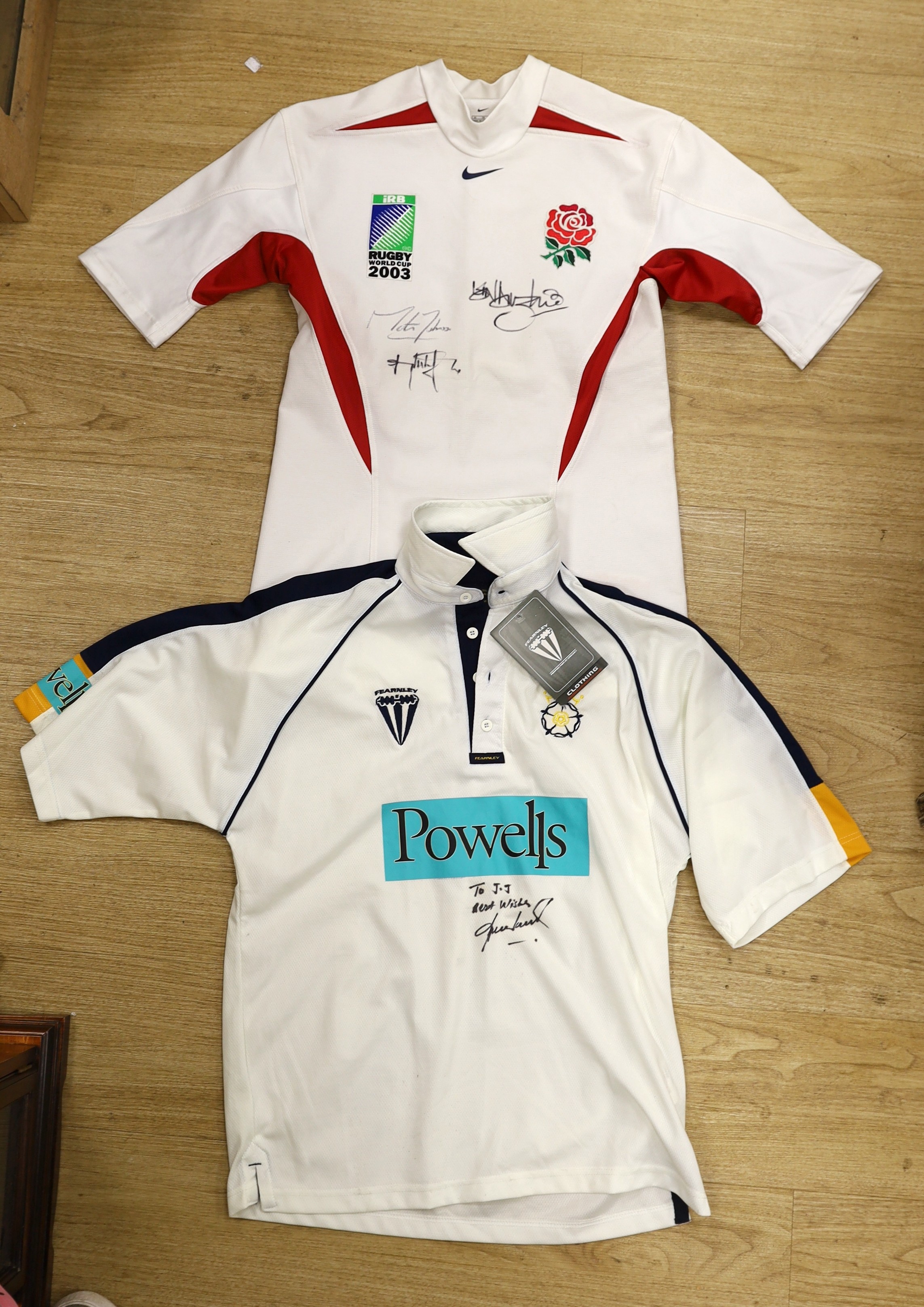 An England Rugby World Cup 2003 shirt signed by Martin Johnson, and two other players and a Hampshire county cricket club shirt signed to JJ best wishes